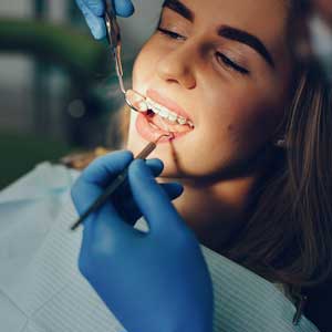 dental checkup woman braces fixed stafford