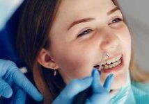 orthodontics-dentistry-smiling-girl-with-braces-teeth-alignment-stafford-st-marys